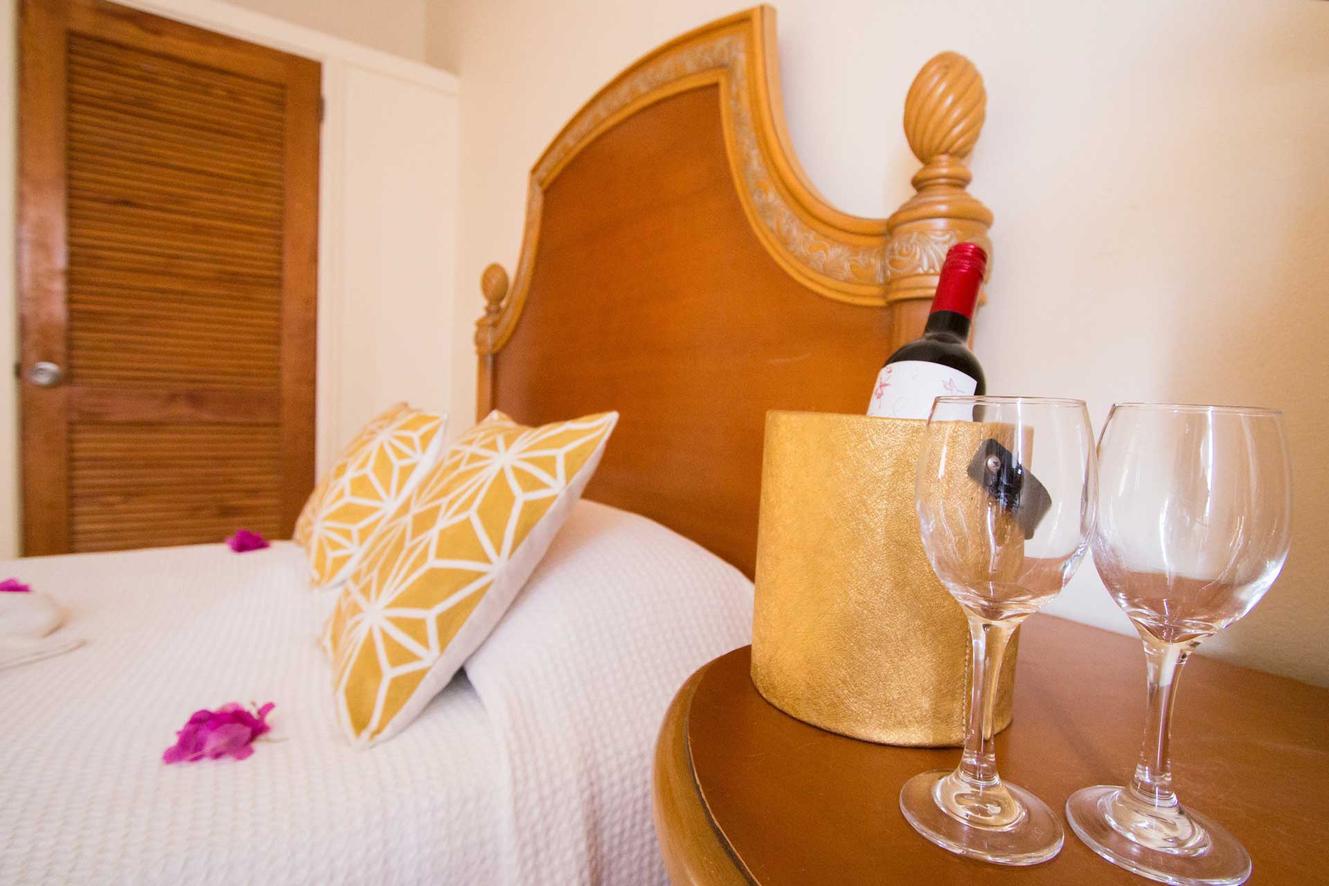 Connies Comfort Suites bedside wine
