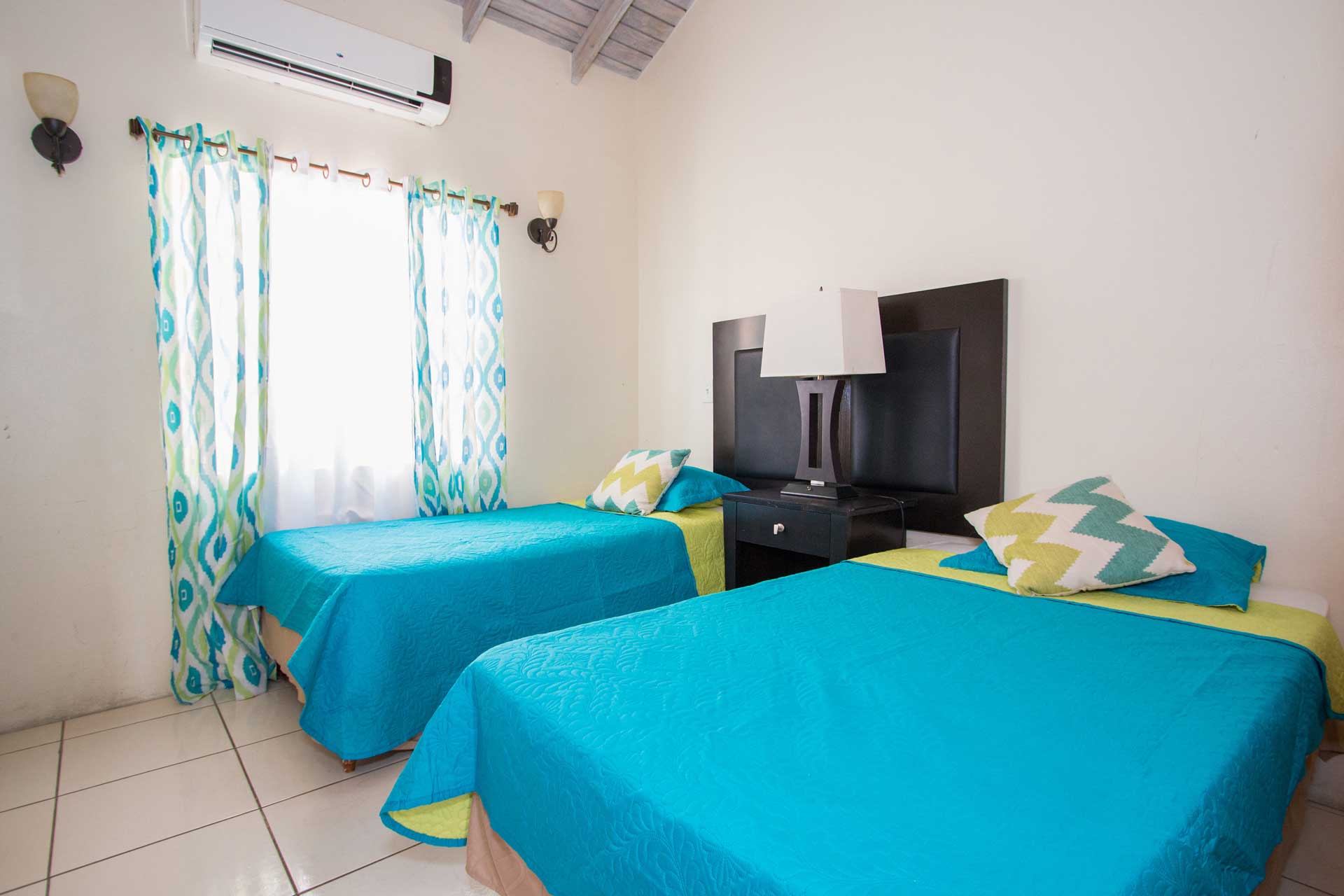 Connies Comfort Suites blue bedroom