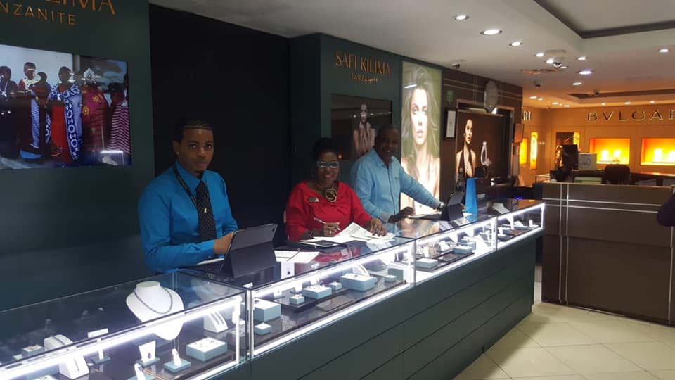 Diamonds International interior with staff