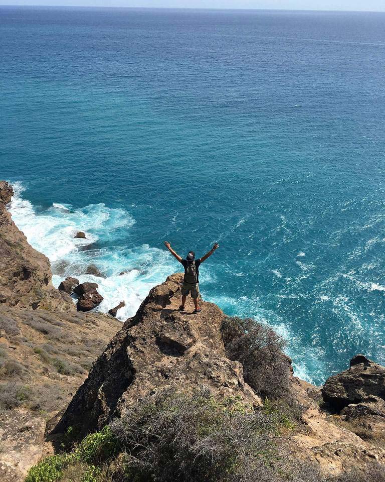 Happy Heights hands up on cliff