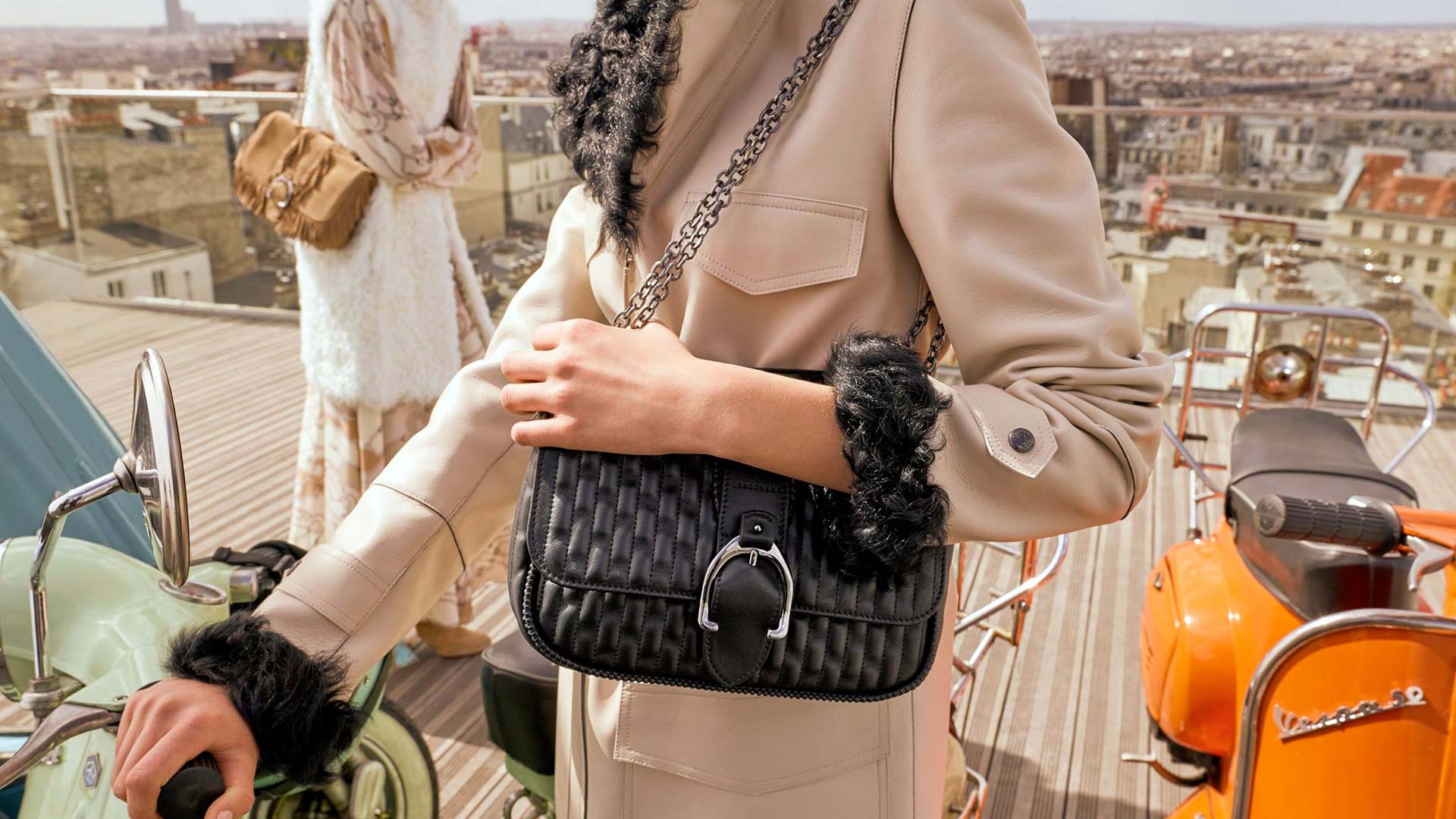 Longchamp pair with bags on rooftop