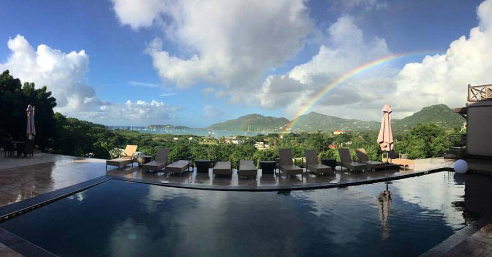 Vine Cottages panoramic pool with rainbow